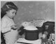 Girl Feeding a Rabbit in a Magician's Hat Poster Print