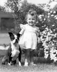 Baby Girl with Dog in Garden Poster Print