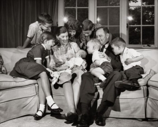 Family Sitting in the Living Room Poster Print showcasing warmth and togetherness.