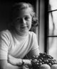 Portrait of Girl Sitting by Window with Plate of Fruits Poster Print
