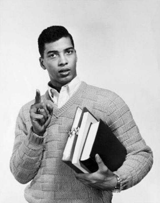 Portrait of a college student holding books and pointing poster print.