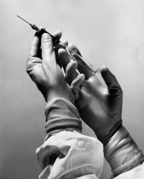 Surgeon's hands holding a syringe poster print