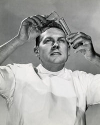 Close-up of a scientist pouring a chemical into a test tube poster print