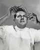 Close-up of a scientist pouring a chemical into a test tube poster print