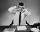 Businessman Suffering from a Headache Poster Print showcasing the stress of the modern workplace.