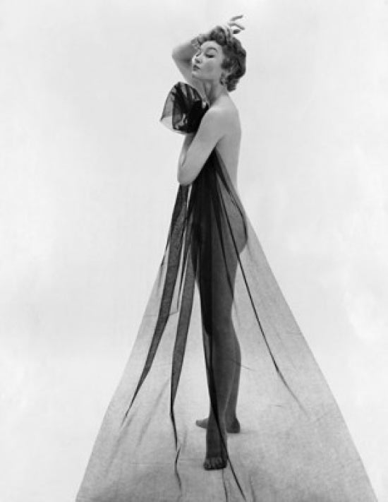 Elegant side profile of a young woman holding a transparent cloth poster print.