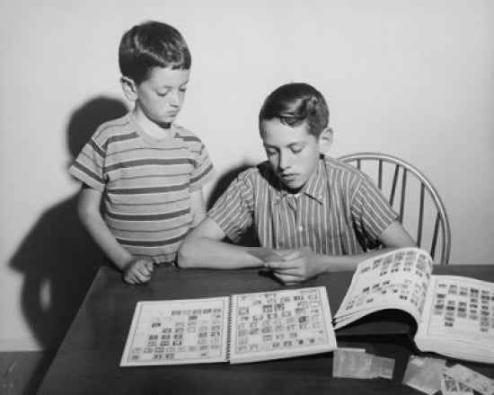 Poster print featuring two children looking at a collection of postage stamps.