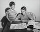 Poster print featuring two children looking at a collection of postage stamps.