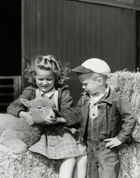 Poster print of a girl and her brother looking at a lamb, perfect for children's decor.
