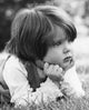 Close-up of a girl lying on the grass poster print