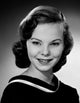 Portrait of a beautiful young woman smiling in studio shot.