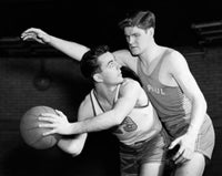 Poster Print of Two Young Men Playing Basketball, showcasing dynamic action.