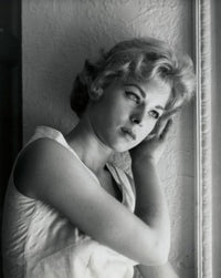 Close-up poster print of a teenage girl in contemplative thought.