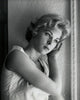 Close-up poster print of a teenage girl in contemplative thought.