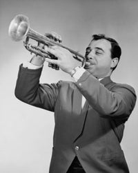 Mid adult man playing a trumpet poster print