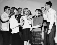 Teenagers enjoying food at a party poster print