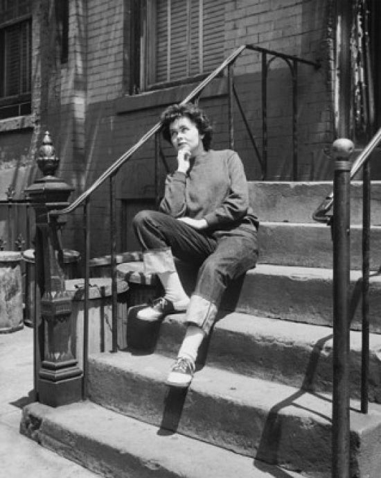 Teenage girl sitting on steps looking upset poster print