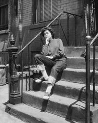 Teenage girl sitting on steps looking upset poster print