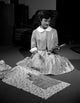 Young Woman Preparing for Sawing Dress Poster Print showcasing an artistic scene.