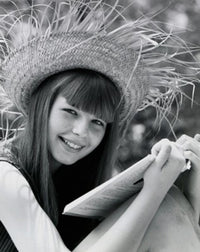 Portrait of a teenage girl holding a book and smiling, poster print