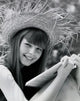 Portrait of a teenage girl holding a book and smiling, poster print