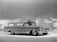 Man and woman standing near a 1959 Oldsmobile Super 88 Fiesta poster print.