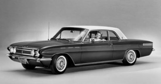 Woman sitting in a classic 1961 Buick Skylark Sports Coupe Poster Print