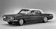 Woman sitting in a classic 1961 Buick Skylark Sports Coupe Poster Print