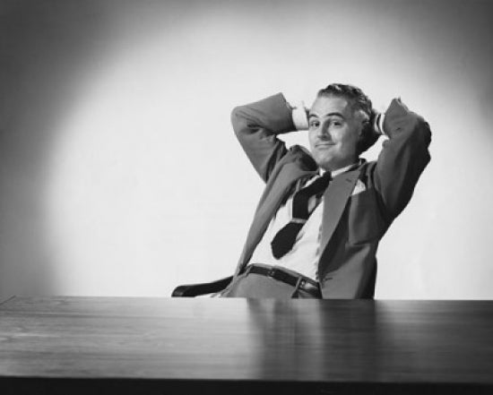 Businessman Sitting with Head in Hands Poster Print depicting deep contemplation.