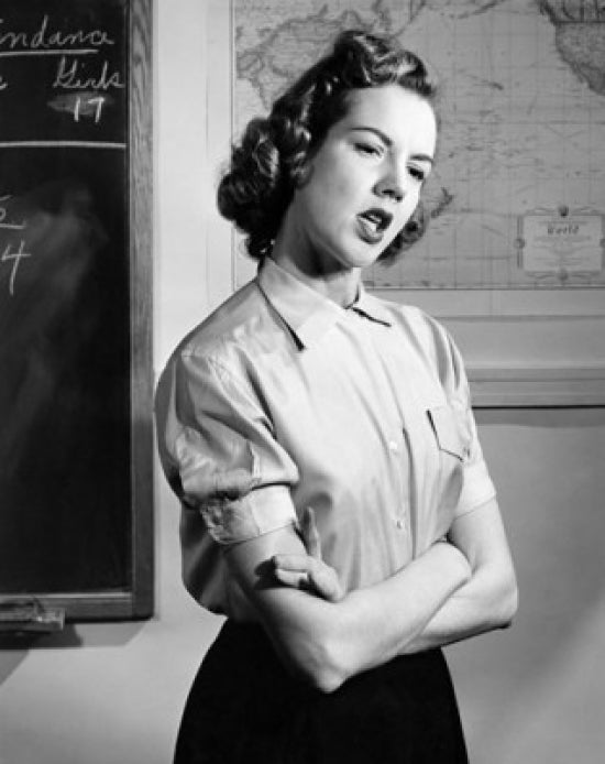 Teenage girl standing with arms crossed poster print.