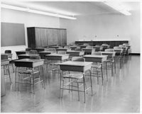 Empty Chairs in a Classroom Poster Print showcasing solitude and reflection.
