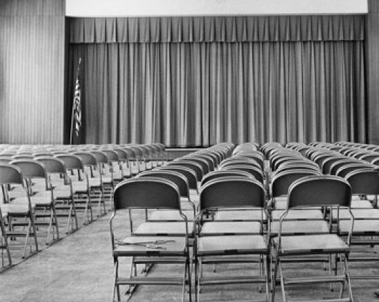 Empty Chairs in an Auditorium Poster Print showcasing a serene educational setting.