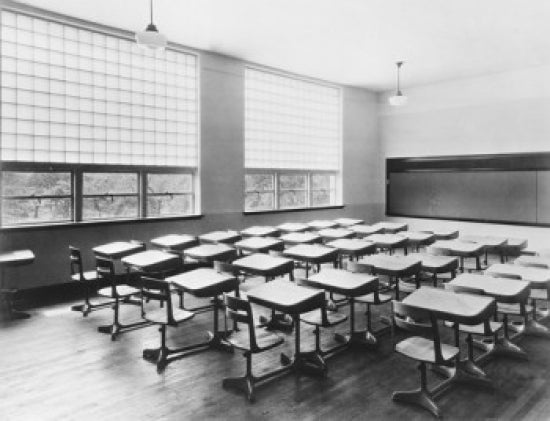 Empty Chairs in a Classroom Poster Print showcasing solitude and reflection.