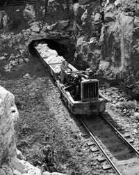 Train emerging from a tunnel with gypsum rocks poster print.