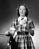 Poster print of a high school student holding paper and smiling.