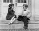 Charming Schoolboy and Schoolgirl Poster Print featuring young love.