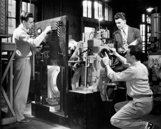 Three college students making a model in a laboratory poster print.