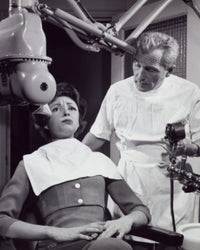 Female Patient Receiving Dental Treatment Poster Print, showcasing dental care moments.