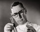 Close-up of a scientist comparing chemicals in test tubes poster print