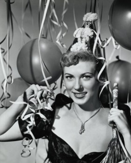 Portrait of a smiling young woman holding a noisemaker, poster print.