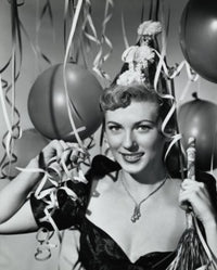 Portrait of a smiling young woman holding a noisemaker, poster print.