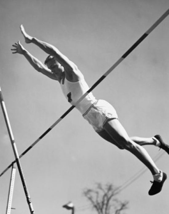 Pole vaulting action poster print featuring a young man in motion.