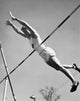Pole vaulting action poster print featuring a young man in motion.