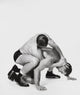 Two Young Men Wrestling Poster Print showcasing athletic competition.
