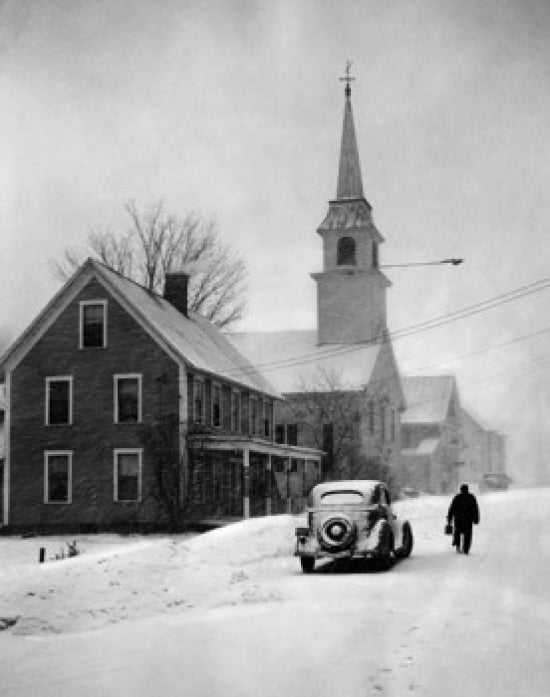 Winter scene poster of a car parked in front of a church.