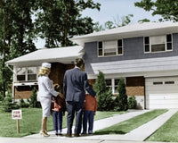 Rear view of parents with children in front of a house poster print.
