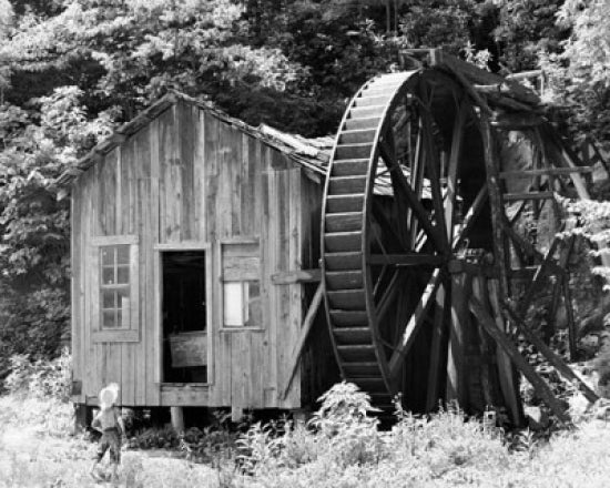 Boy standing in front of a water mill poster print from North Carolina