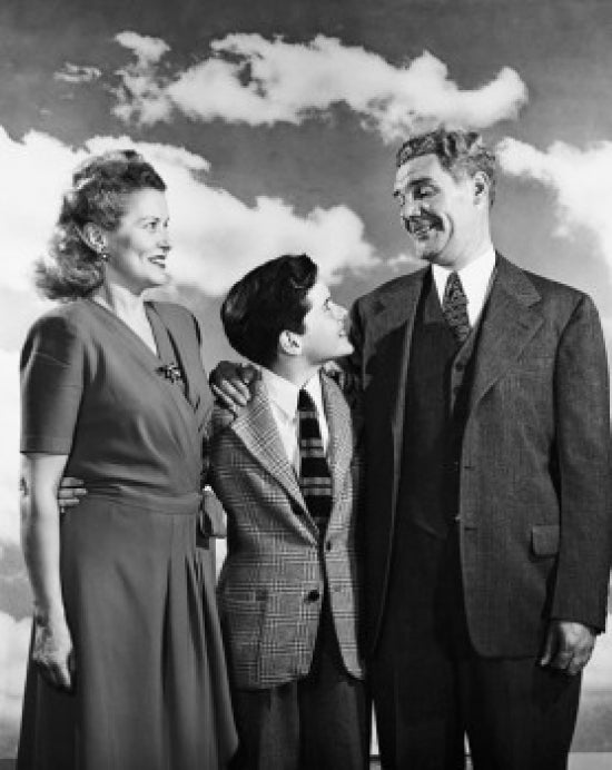 Poster print of mature couple smiling with their son, showcasing family love.