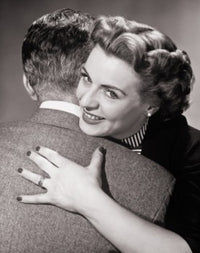 Close-up of a mid adult couple embracing each other poster print.