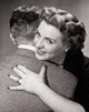 Close-up of a mid adult couple embracing each other poster print.
